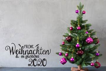 Fototapeta na wymiar German Calligraphy Frohe Weihnachten Und Ein Glueckliches 2020 Mean Merry Christmas And A Happy 2020. Tree With Purple Christmas Ball Ornament. Gray Concrete Background.