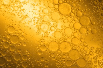 Biodiesel, bubbles biofuel, vegetable oil, yellow and orange emulsion bubbles background