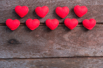 Fototapeta premium Fabric red heart on wooden background
