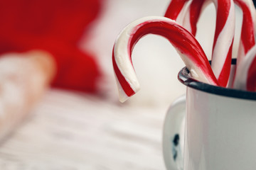 Cup full of candy canes close up