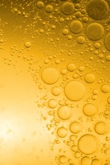 Biodiesel, bubbles biofuel, vegetable oil, yellow and orange emulsion bubbles background