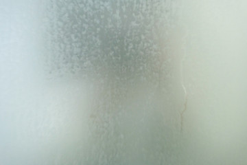 Steam on the glass in shower room, blurry steam on mirror in shower room