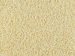 Polished millet -texture and details - traditional food. Top view. Textures and backgrounds.