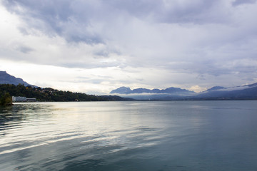 clouds over lake beautiful panorama horizon view water reflection france alps mountain region travel