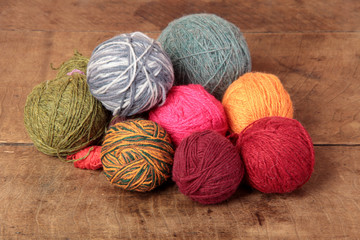 Balls of wool for knitting one wooden table