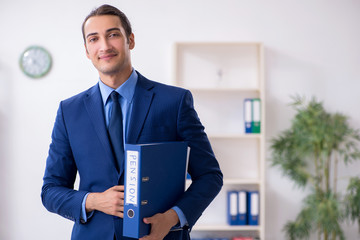 Young male accountant working in the office