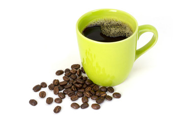 Black coffee in green ceramic cup and coffee beans isolated on white background. 