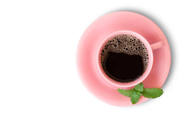 Closeup pink ceramic cup of black coffee with mint leaves isolated on white background with clipping path. Overhead view.