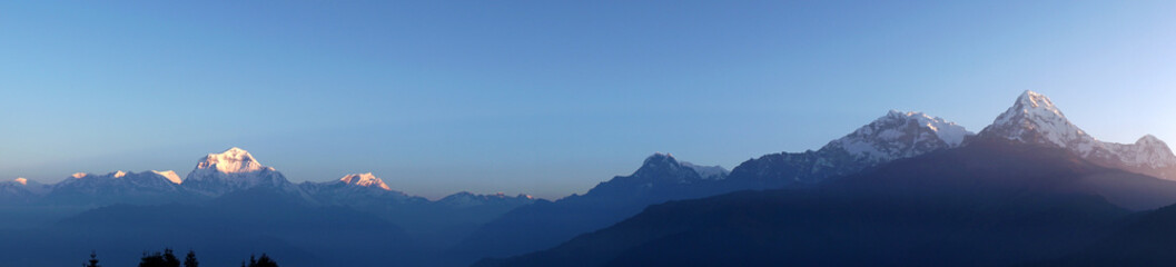 Landscape panorama Annapurna mountain on himalaya rang mountain in the morning seen from Poon Hill, Nepal - Blue Nature view - Travel Trekking Concept