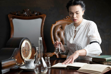 Vintage chemist experimenting. Science research concept.