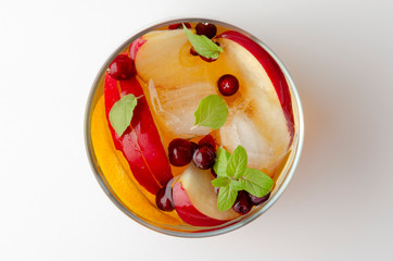 Spiced apple mocktail with mint and cinnamon. White background