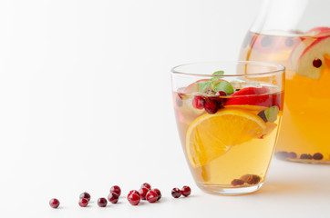 Spiced apple mocktail with mint and cinnamon. White background