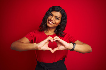 Beautiful transsexual transgender woman wearing t-shirt over isolated red background smiling in...