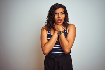 Naklejka premium Transsexual transgender woman wearing striped t-shirt over isolated white background shouting suffocate because painful strangle. Health problem. Asphyxiate and suicide concept.