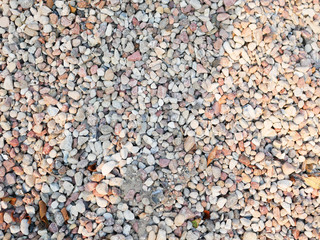 Pebbles closeup. High quality close up photo of various pebbles. On a sunny day. dry stone