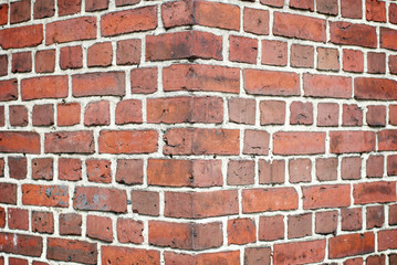 Full frame corner close-up of traditional red brick wall abstract background