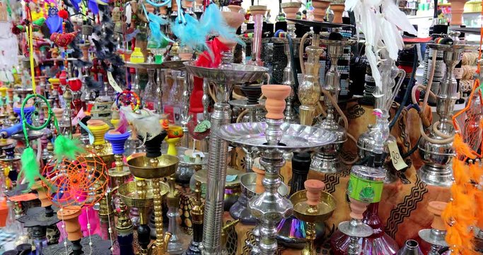 Traditional colorful Arabic pipes hookah.Various Hookahs for Sale in an Arab Souvenir Store. 