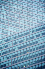 Abstract geometric background of a modern glass office tower skyscraper 