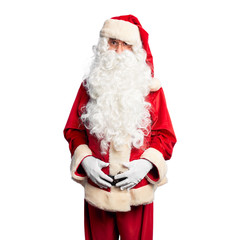 Middle age handsome man wearing Santa Claus costume and beard standing depressed and worry for distress, crying angry and afraid. Sad expression.