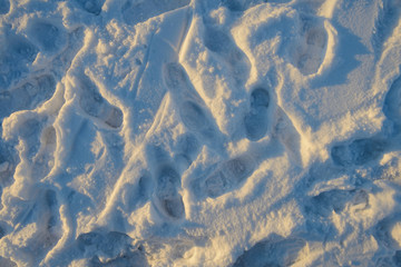 Traces of shoes on the surface of a snowdrift
