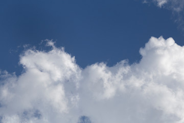 Clouds in the blue sky. White fluffy clouds in the blue sky.