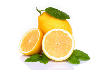 Fresh yellow lemon lime fruit with green leaf and cut in half sliced isolated on white background .