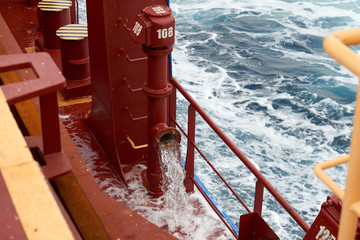 View of Ballast Water exchange process onboard of a ship using flow-through method underway in open...