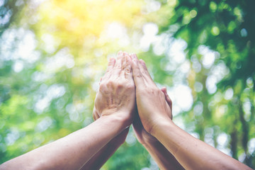 People hands assemble as a connection meeting teamwork concept. Group of people assembly hands as...