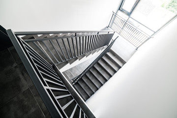 Stairs and handrails in design. Elements of metal on stairs