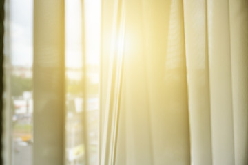 white transparent window curtain soft focus, light through blind illuminate bedroom in early morning