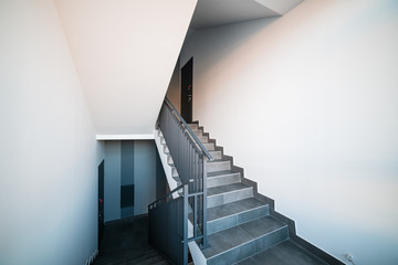 Stairs and handrails in design. Elements of metal on stairs