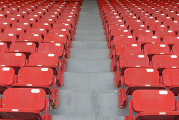 Red stadium seats,sport outdoor horizontal row seating.