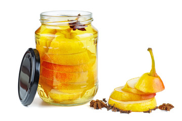 Sliced pears canned in glass jar isolated on white background.