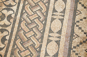 Ancient Roman mosaic tile flooring in intricate patterned variations in a full frame background