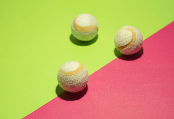 White tennis balls on trendy background