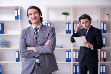 Two young businessmen meeting in the office