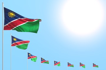 pretty any feast flag 3d illustration. - many Namibia flags placed diagonal on blue sky with place for content
