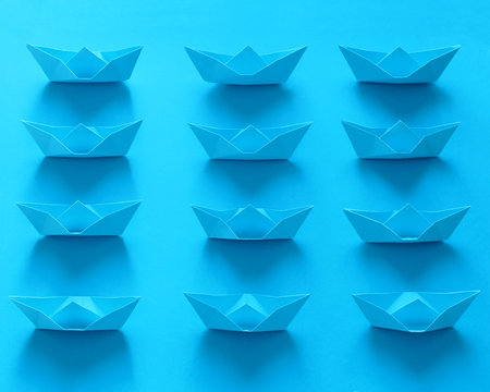 Close Up Real Origami Boats On Blue Background