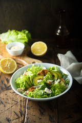 Homemade Caesar salad with chicken and avocado