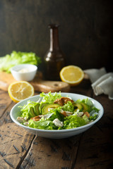 Homemade Caesar salad with chicken and avocado
