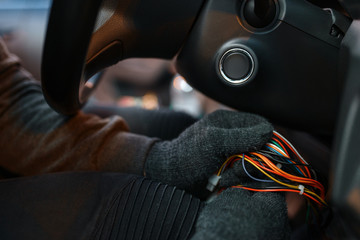 Professional car thief hacking ignition lock