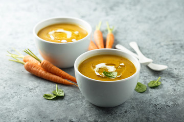 Homemade carrot cake with cream and basil