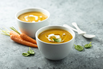 Homemade carrot cake with cream and basil