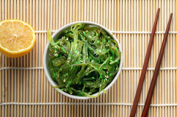 Top View of hiyashi wakame or chuka salad. Seaweed food salat with sesame.