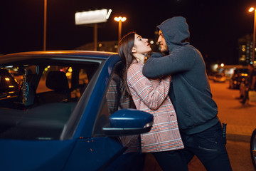 Female driver and bandit at the car, crime, robber