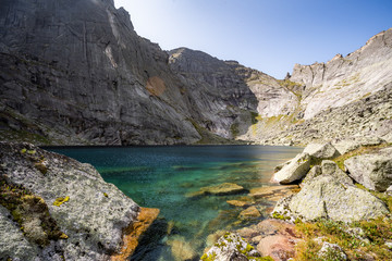 A magnificent mountain lake surrounded by cliffs