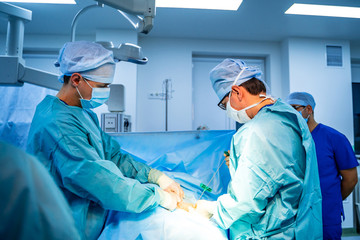 Stem cells operation. Health care concept. Surgeons team working. Bone marrow transplant operation....
