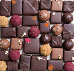 Chocolate candy making. Handmade candy. Sweets from dried fruits and nuts.