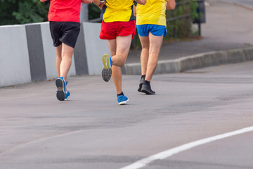 Fototapeta na wymiar Marathon running race, people feet on city road