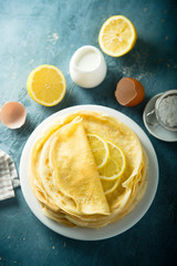 Homemade crepes with lemon and sugar
